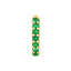 A pair of gold emerald pave huggie earrings close up.