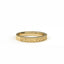 Gold ring with intricate design on a white background