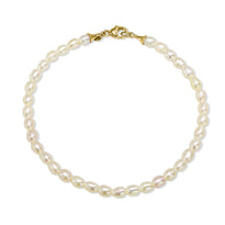 An oval shaped fresh water pearl bracelet with bell end loops and lobster clasp. 