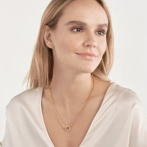 This gold chain features half paperclip and half rolo links with two round loop ends meant for necklace clasp and connectors. 