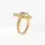 Gold ring with a diamond on a white background
