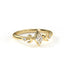 Gold ring with diamond accents on a white background