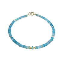 A bright colored opal beaded bracelet with solid gold beaded accents and round clasp. 