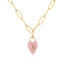 Gold chain necklace with a pink heart-shaped pendant on a white background