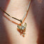 a pixie charm with diamond and wings and dangling stars