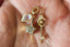 Diamond star moon key and moonstone charm showing on the palm