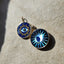 around disc evil eye pendant with in lay and diamond moon