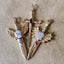 three gold swords with diamonds