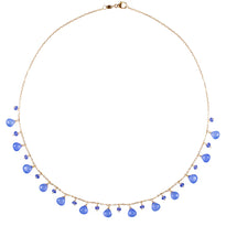 Necklace with blue beads on a white background
