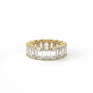 Gold and diamond ring on a white background