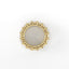 Round mirror with gold frame on a white background