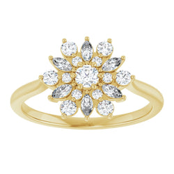 Gold ring with diamond-studded design on a white background