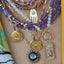 A octagon shaped pendant with a crab astrological cancer design.  
