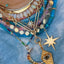 A gold connector that is designed to look like a snake eating it's tail. The sneak head has gemstone or diamond eyes and the tail clicks into the head for closure. 