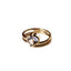 A heart bezel set with a swirl gold band. 