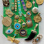 A 22k over silver Egyptian goddess Isis with her crown and her arms expanded out with wings underneath. On her head, there is an evil eye with turquoise enamel and a diamond. 