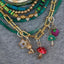 The green star mushroom styled with other charms and chains. 