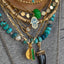 A large turquoise blue beaded necklace with pearls hand knotted with crystals for a mixed look. Finished with solid gold findings and gold clasp. 