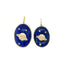Solid gold Saturn pendant with stars set in lapis stone. The Saturn is set inside the lapis creating a flushed look. 