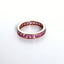 A eternity ring set with princess cut pink sapphire gemstones. 