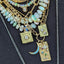 A gold square pendant with three round diamond bezel set in a asymmetric way. 