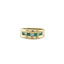 Product picture of a vintage diamond and emerald alternate gemstone band. The ring is made in solid gold and has a thick boarder on top and bottom of the row of stones. 