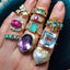 A vintage ring with marquise shaped diamonds and emeralds alternate design. with a gold flat edge band. 