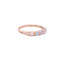 A simple gold band ring made with five round opal cabochon gemstones. Four prong set. 